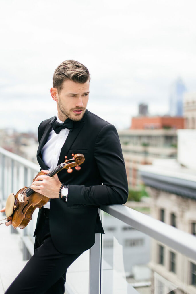 Violinist Filip on the rooftop in Flatiron District NYC photo by Jan Freire