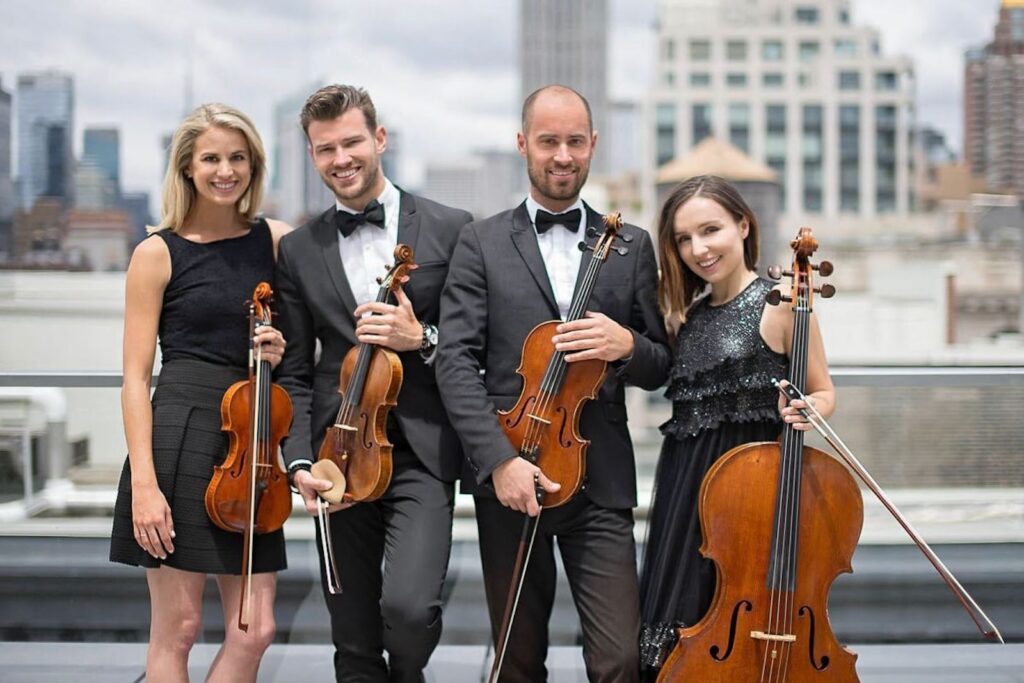New York Virtuosi string quartet | Violinsit and cello player after fashion show at the NYPL