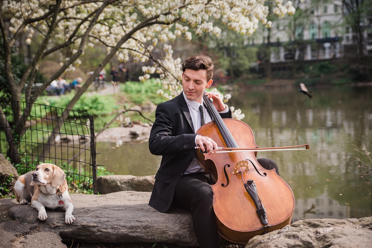 Cellist Samuel in Central Park near Plaza Hotel in NYC | New York Virtuosi wedding musician