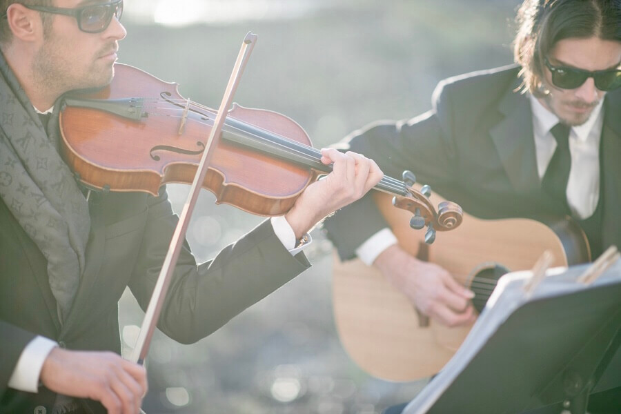 New York Virtuosi Violin and Guitar Duo performing at a wedding ceremony at Liberty House in Jersey City